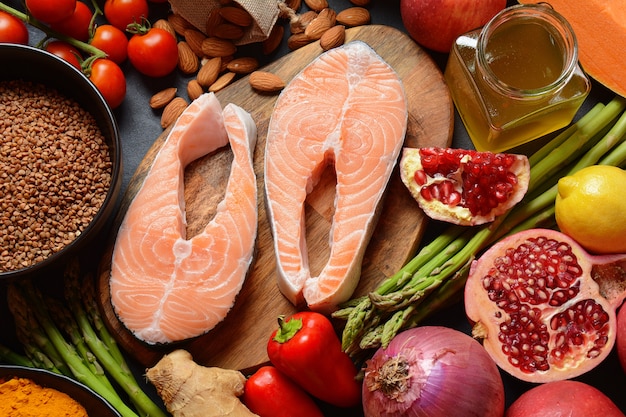 Selection of healthy products - salmon, almonds, pumpkin, buckwheat and others