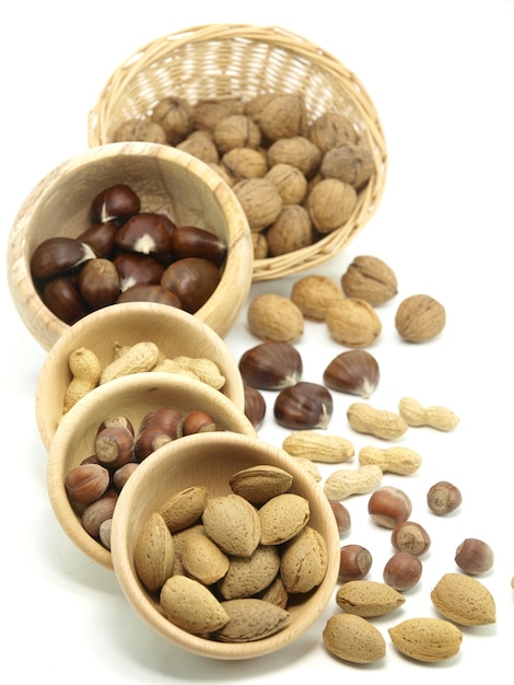 A selection of nuts in baskets with one that says'nuts '