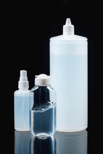 Selection of Sanitizers on a Black Background Personal Protection Products Against Coronavirus