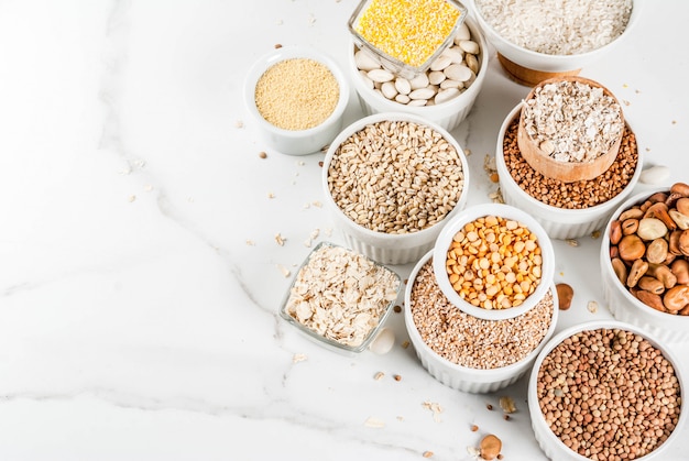 Selection various types cereal grains groats  in different bowl