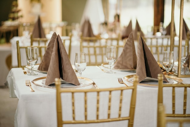 Selective of a decorated table in a hall for a great event