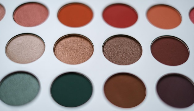 Photo selective focus of eyeshadow palette with various colors in pearly and matte closeup