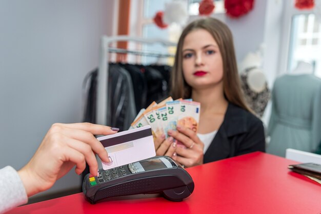 Selective focus on female hand with credit card