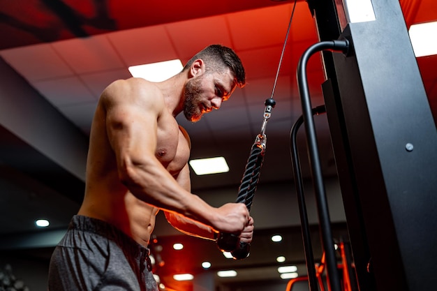 Selective focus on man training in gym View from below on strong athletes hands