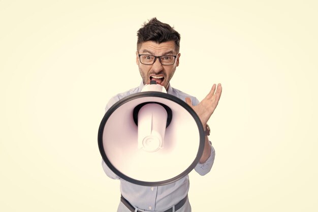 Photo selective focus of man with megaphone announcement man with megaphone isolated on white background man with megaphone announcement in studio man shouting announcement in megaphone