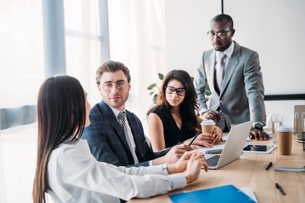 Selective focus of multicultural business people having business meeting in office