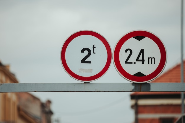 Selective focus shot of weight limit and height limit signs