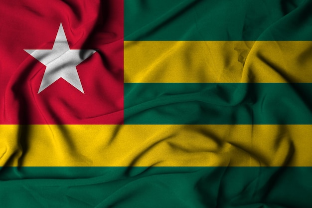 Selective focus of togo flag, with waving fabric texture. 3d illustration