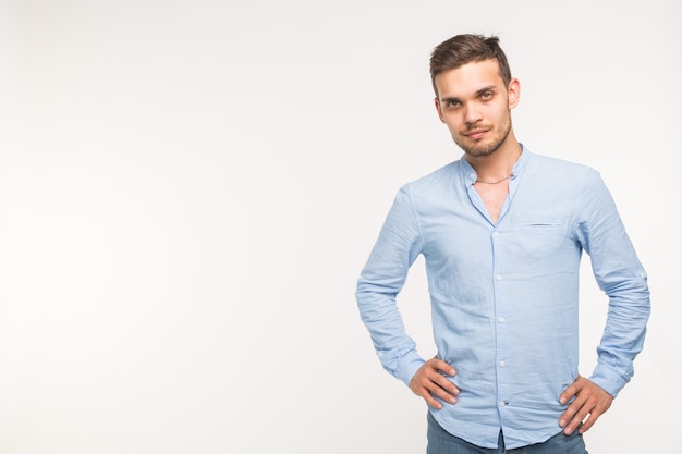 Self-confidence, business and people concept - Successful handsome man with smile on white background with copy space.