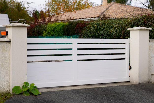 Self-opening door aluminum white gate of home portal of suburb house