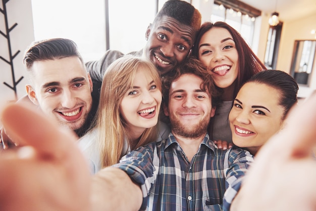 Self portrait of mixed race unity of african, american, asian, caucasian friends