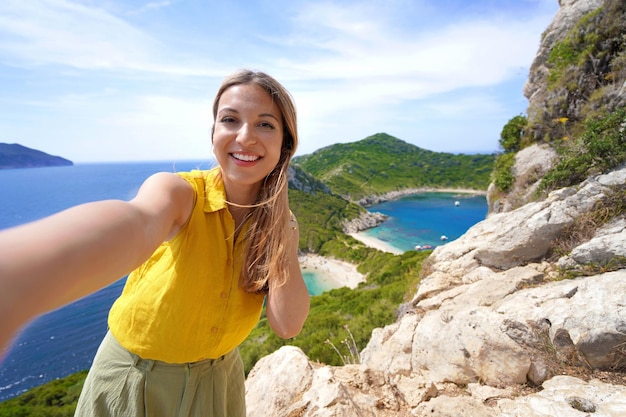 Self portrait of young traveler woman from Porto Timoni Viewpoint in Corfu Greece