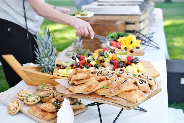 Self service food buffet Guests at a relaxed party outdoor Horizontal photo