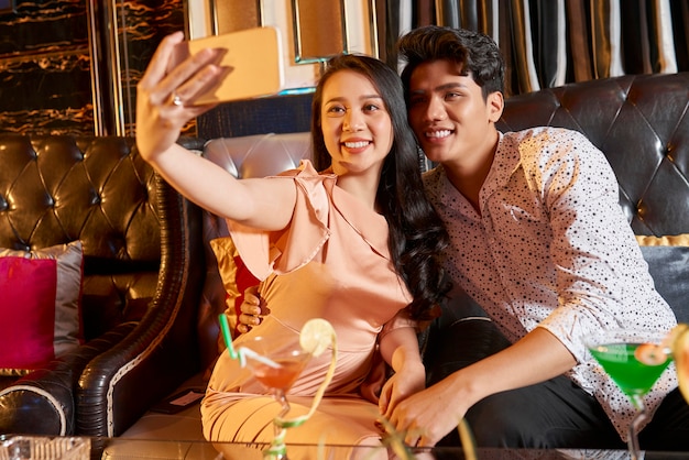 Selfie portrait of couple in restaurant