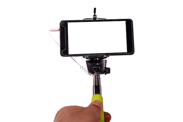 Selfie stick with modern smartphone isolated on a white background