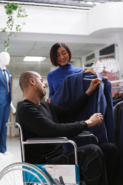 Seller assisting customer in wheelchair