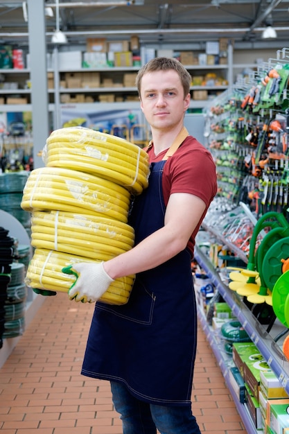 Seller with equipment tools at store