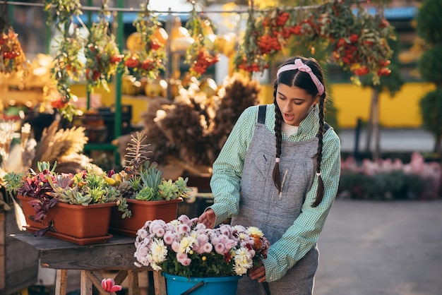 Selling flowers places flowers in a bucket for sale