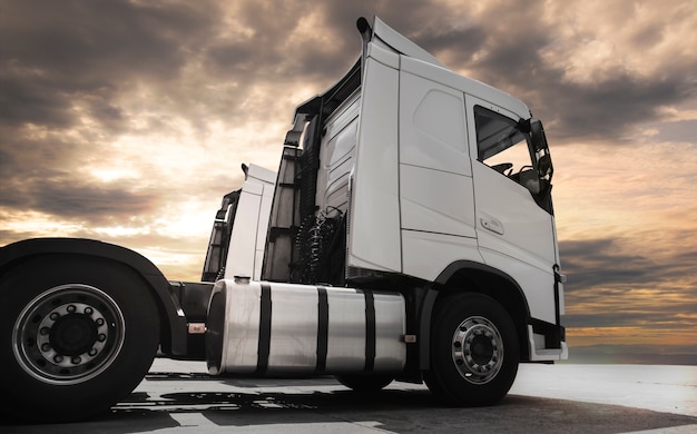 Semi-truck on parking at sunset sky.