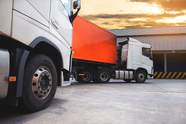 The semi truck trailer at warehouse, freight industry logistics and transport