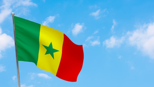 Senegal flag on pole. Blue sky. National flag of Senegal