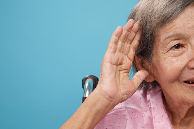 Senior adult woman hearing loss Hard of hearing