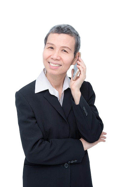 Senior asian businesswoman talking by cellphone over white