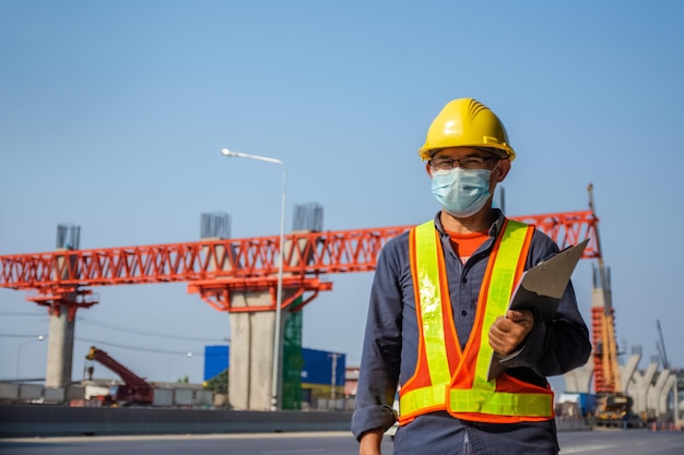 Senior Asian Engineer construction are worker employee working by safety control helmet on site building