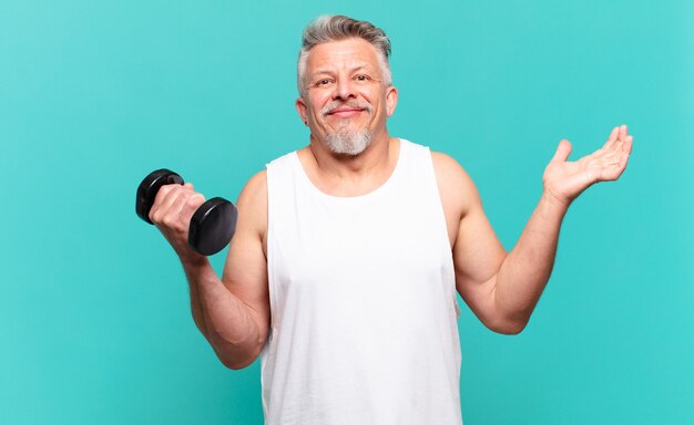 Senior athlete man feeling puzzled and confused doubting