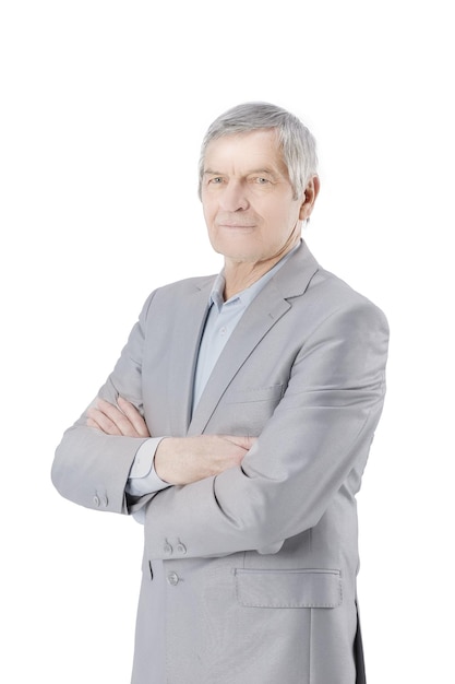 Senior businessman standing with arms crossed on white background