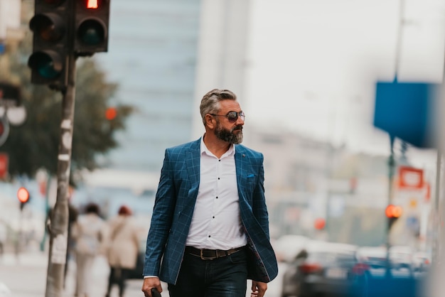 A senior businessman in a suit walking around the city after work