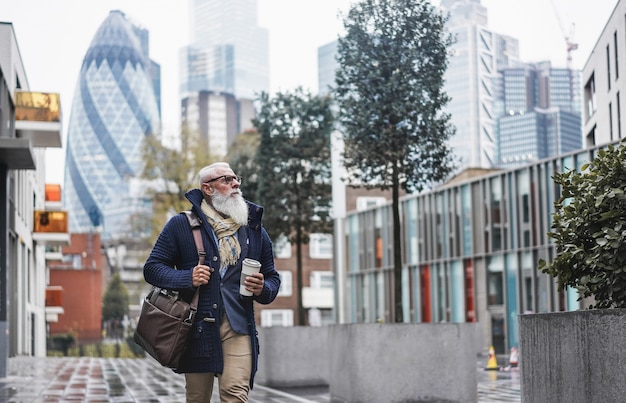 Senior businessman walking to work