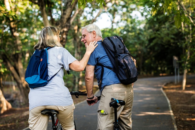 Senior couple biking at the park