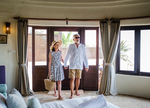 Senior couple checking in to a resort