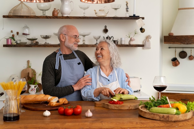 Senior couple cooking together in the kitchen