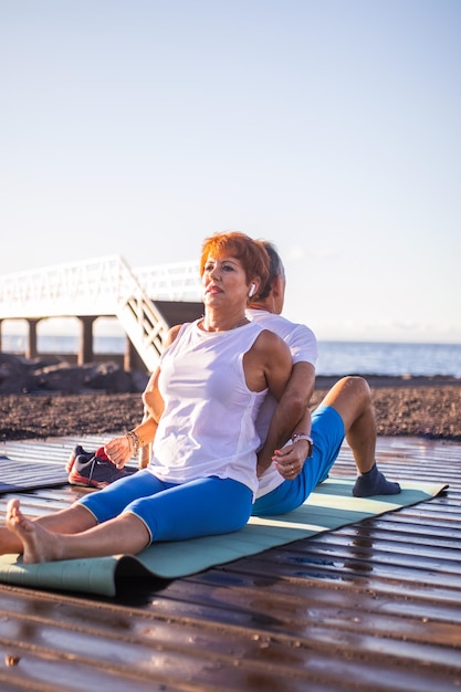 senior couple exercising together in the morning