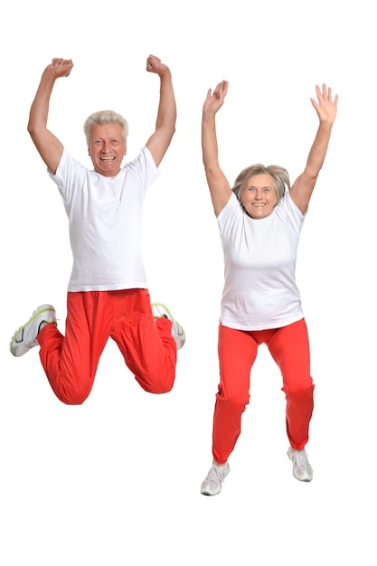 Photo senior couple exercising on a white background