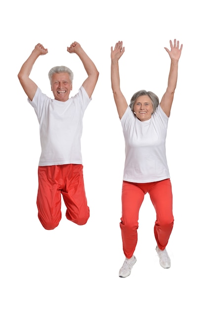 Photo senior couple exercising on a white background