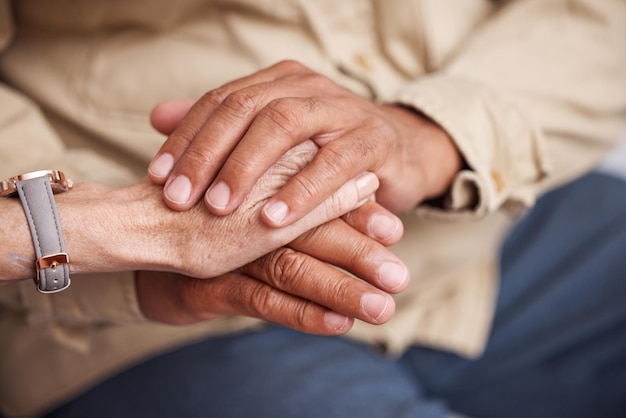 Photo senior couple holding hands for support love and comfort together in retirement cancer empathy or faith prayer closeup man old woman and helping hand with trust care and psychology counselling