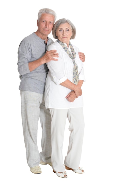 Senior couple hugging isolated on white background full length