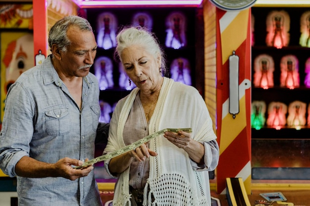 Senior couple looking at their raffle tickets