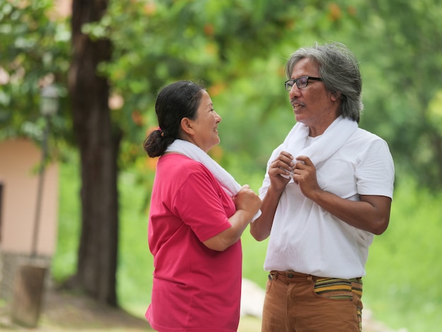 Senior couple lover exercising together in morning at Park. Health care concept.