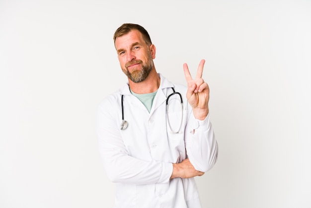 Senior doctor man isolated on white wall showing number two with fingers.