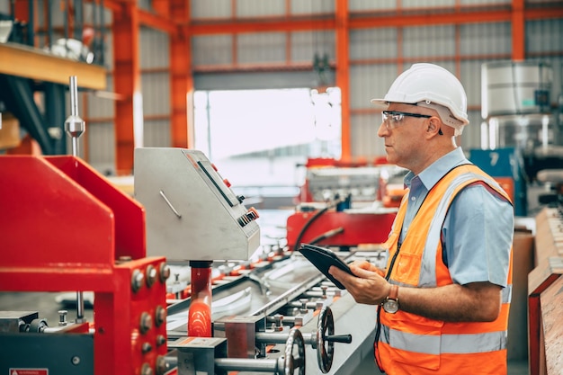 Senior engineer professional worker caucasian worker working in heavy industry factory