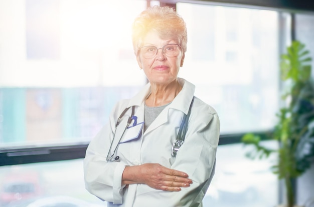 Senior female doctor smiling in hospital