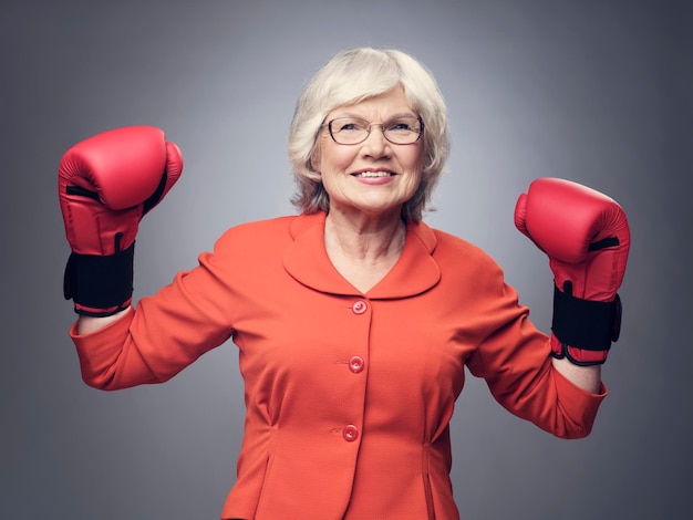 Senior lady in boxing gloves