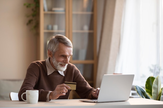 Senior male ready to shop online