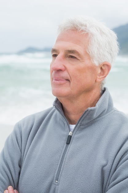 Senior man looking away at beach