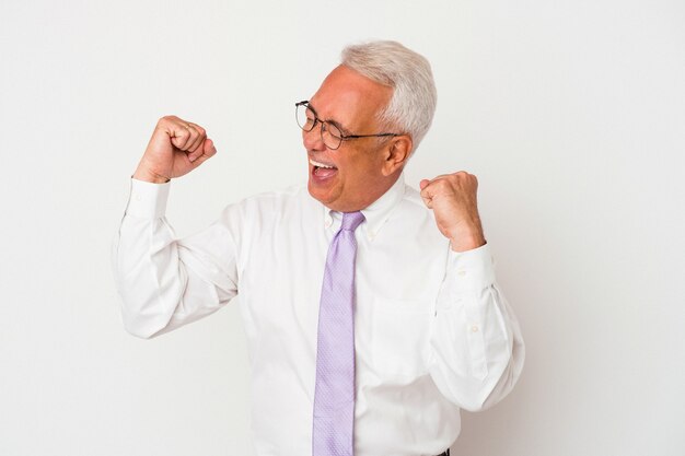 Senior man raising fist after a victory, winner concept.