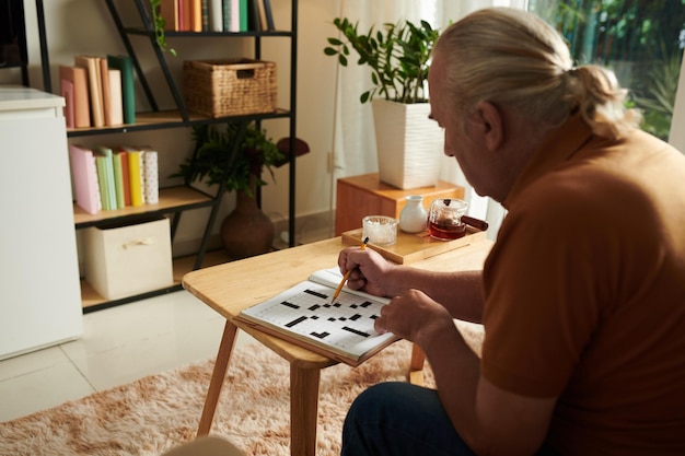 Senior Man Solving Crossword